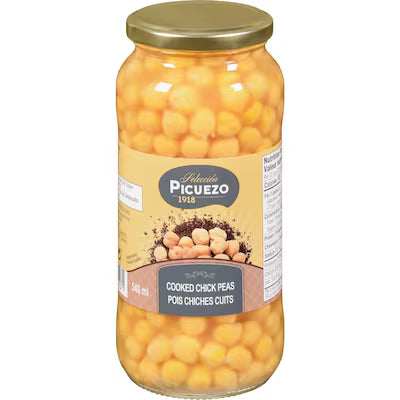 A packaged food product in a sealed bag with a front label displaying branding, product name, and nutritional information
