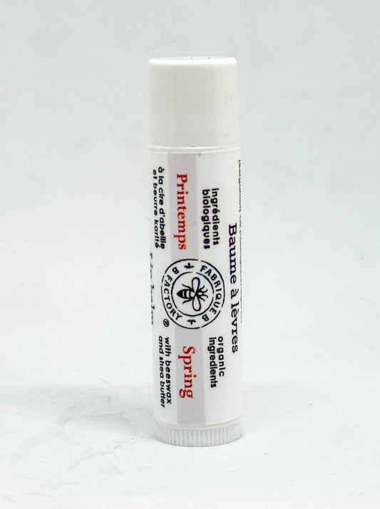 A "Spring" lip balm tube by B Factory on a white background
