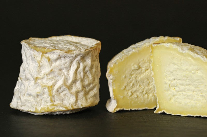 A wheel of Fromagerie du Vieux St. Joseph Brébiole cheese, featuring a soft, creamy sheep’s milk cheese with a delicate rind.