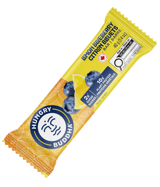 Hungry Buddha Lemon Blueberry protein bar in yellow packaging on a clear background