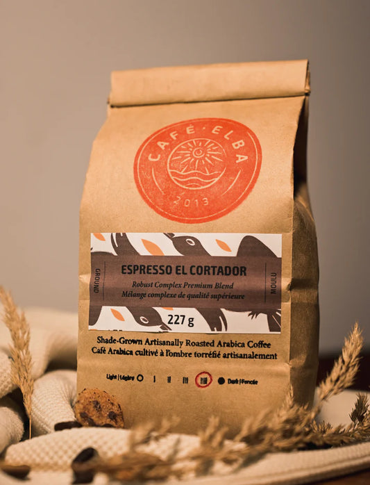 A bag of Café Elba whole bean coffee Espresso El Cortado, showcasing a bold espresso blend of roasted beans in branded packaging.