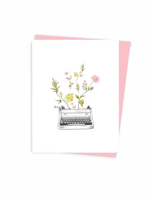 Greeting card with a typewriter and flowers on a white background with a pink envelope