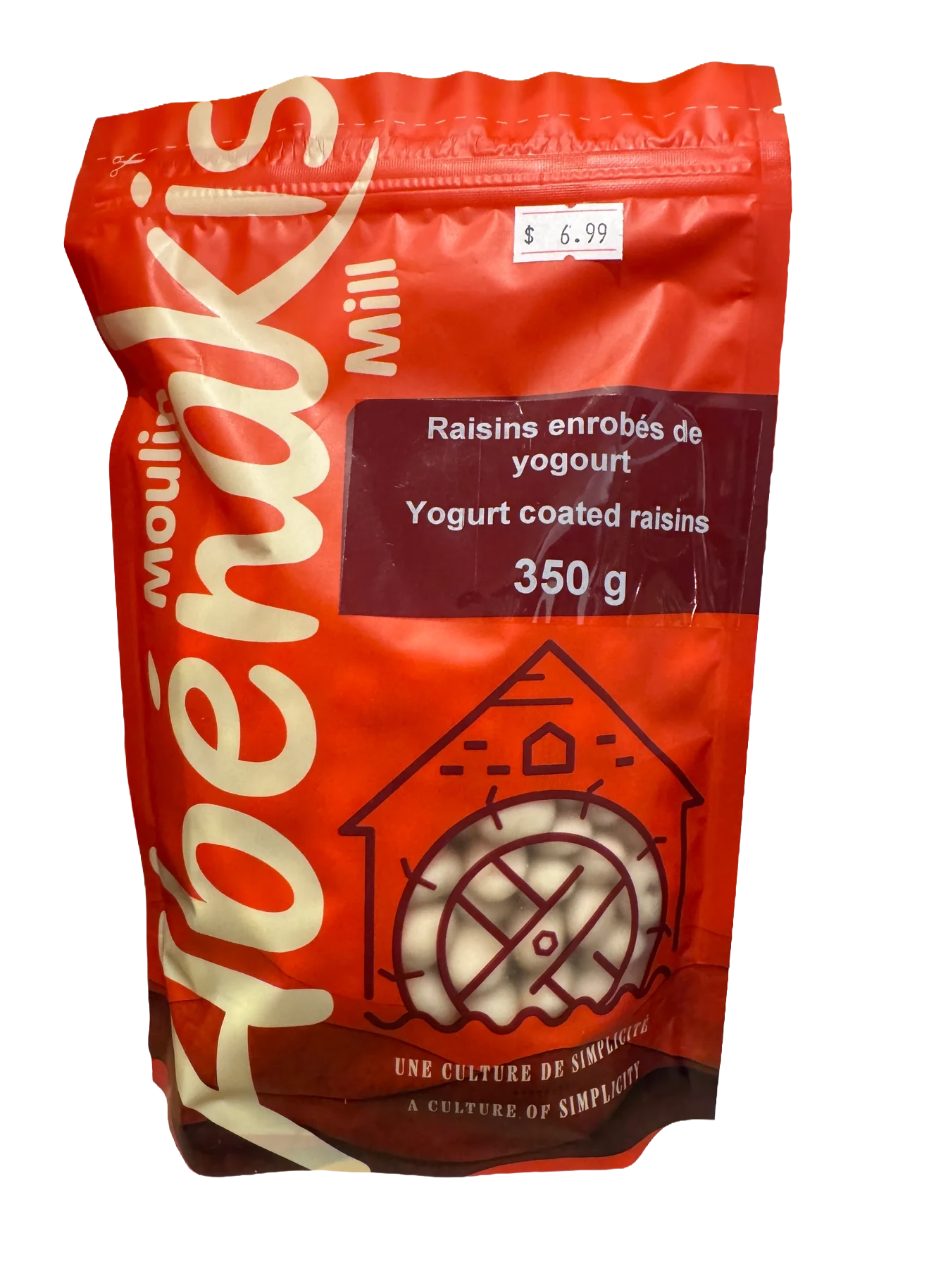 Abénakis Yogurt coated raisins in orange bag on a wood shelf