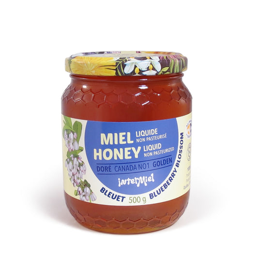 A jar of blueberry blossom from Intermiel on a white surface