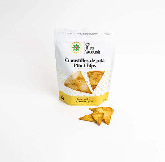 A bag of Zaatar and thyme flavoured pita chips by Les Filles Fattoush on a white background