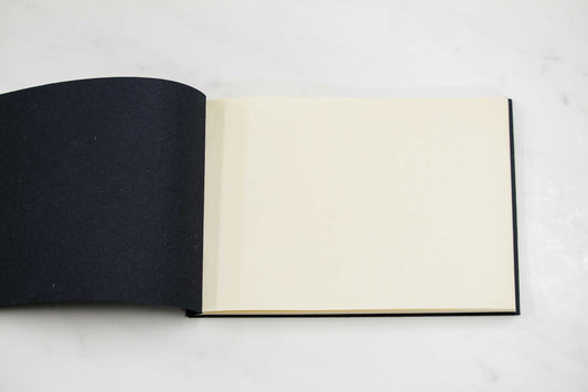 5 1/2-inch by 8-inch handmade Papeterie St. Armand cotton paper notepad open on table