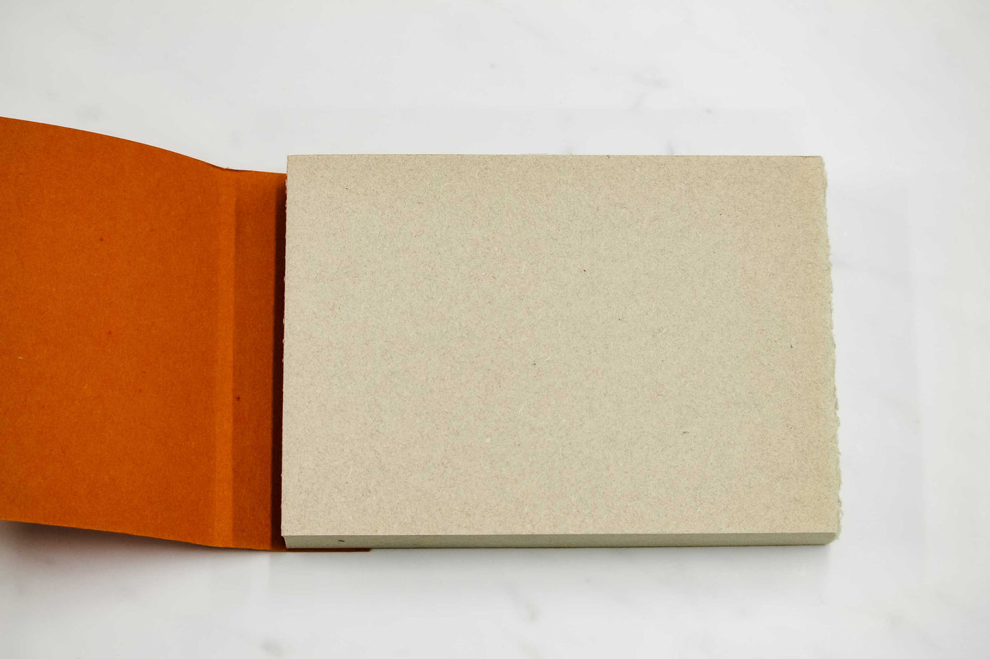 6-inch by 8-inch handmade Papeterie St. Armand cotton paper notepad open on table