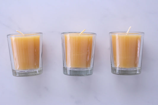 3 handmade beeswax votive candles in glass votive holders
