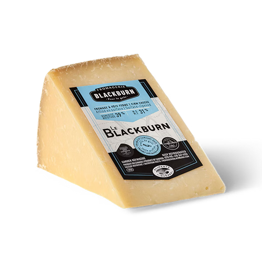 A wheel of Fromagerie Blackburn cheese, featuring a semi-firm texture with a natural rind and pale interior in branded packaging.