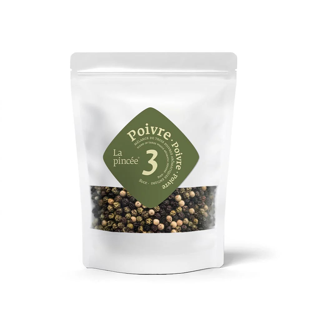 Packaged peppercorns with a green label on a white background