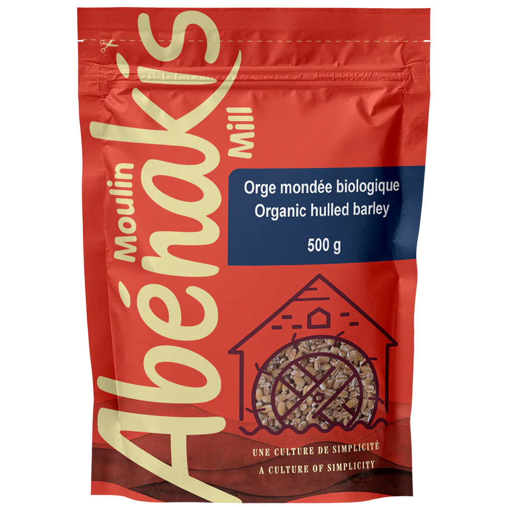 A bag of ABÉNAKIS organic hulled barley (500g), featuring whole grain barley in natural, resealable packaging.