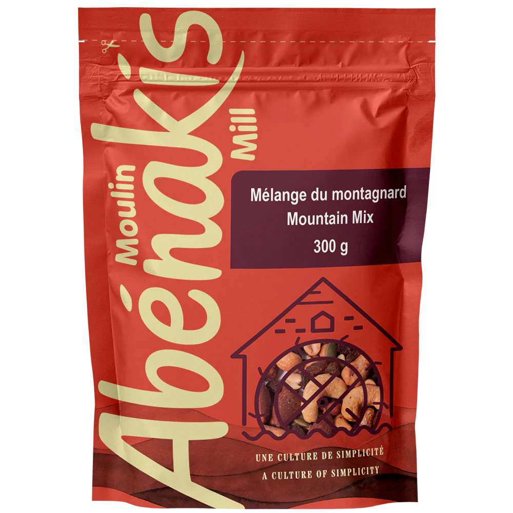 A bag of ABÉNAKIS Mountain Mix, featuring a blend of nuts, dried fruits, and snacks in resealable packaging.