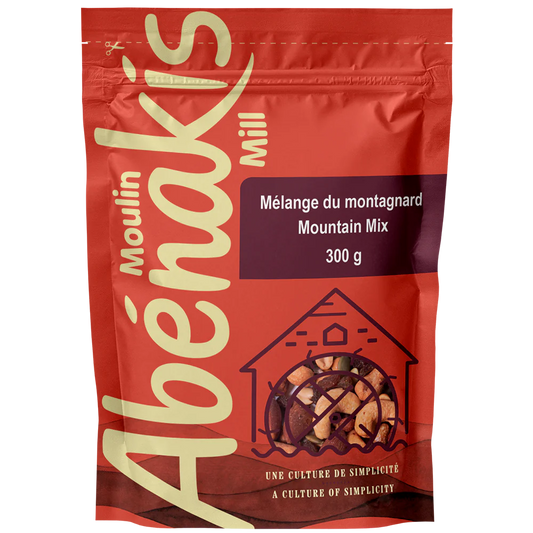 A bag of ABÉNAKIS Mountain Mix, featuring a blend of nuts, dried fruits, and snacks in resealable packaging.