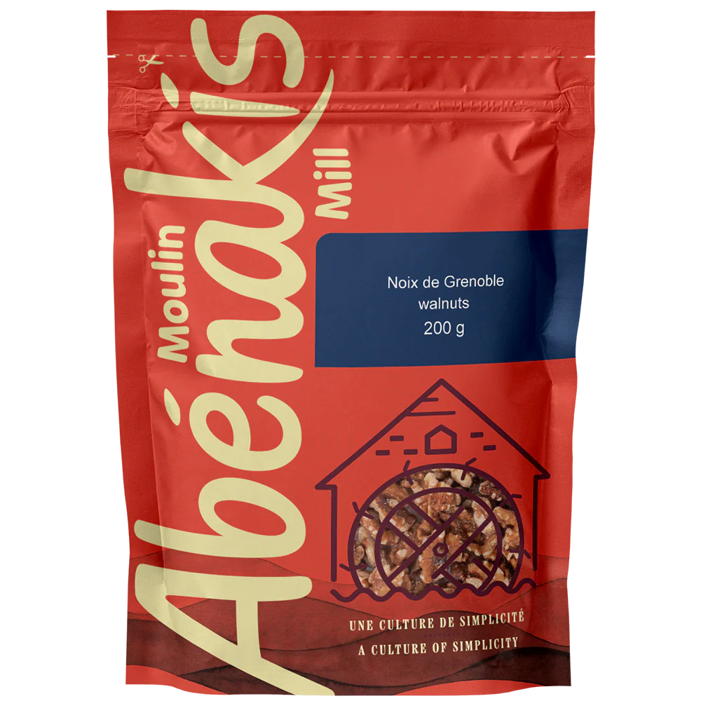 Moulin Abénakis orange bag of shelled walnuts on a white background