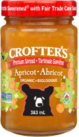 A jar of Crofter’s Just Fruit organic apricot spread, featuring a golden fruit spread made with organic apricots in labeled packaging