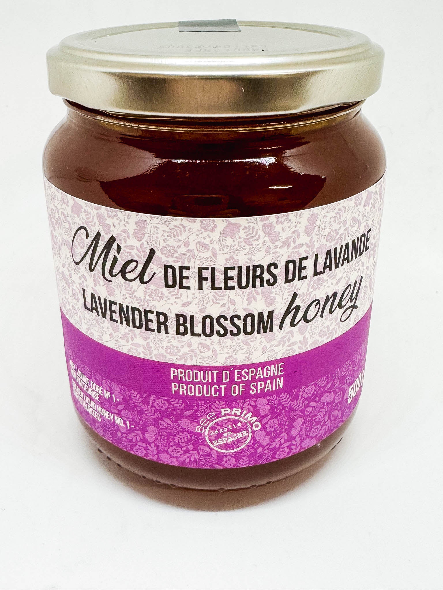 A jar ofSpanish Lavender blossom honey from Bee Primo on a white background