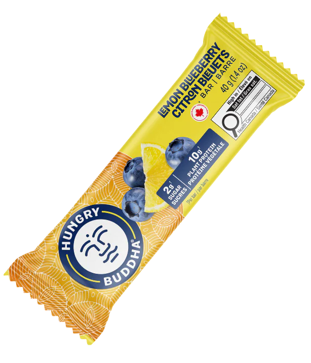 Hungry Buddha Lemon Blueberry protein bar in yellow packaging on a clear background