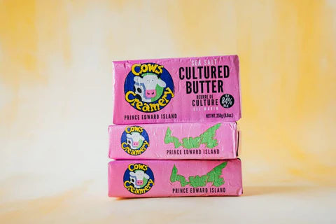 A package of Cows Creamery cultured butter (84% fat), featuring a rich, creamy butter made from cultured cream in branded packaging.