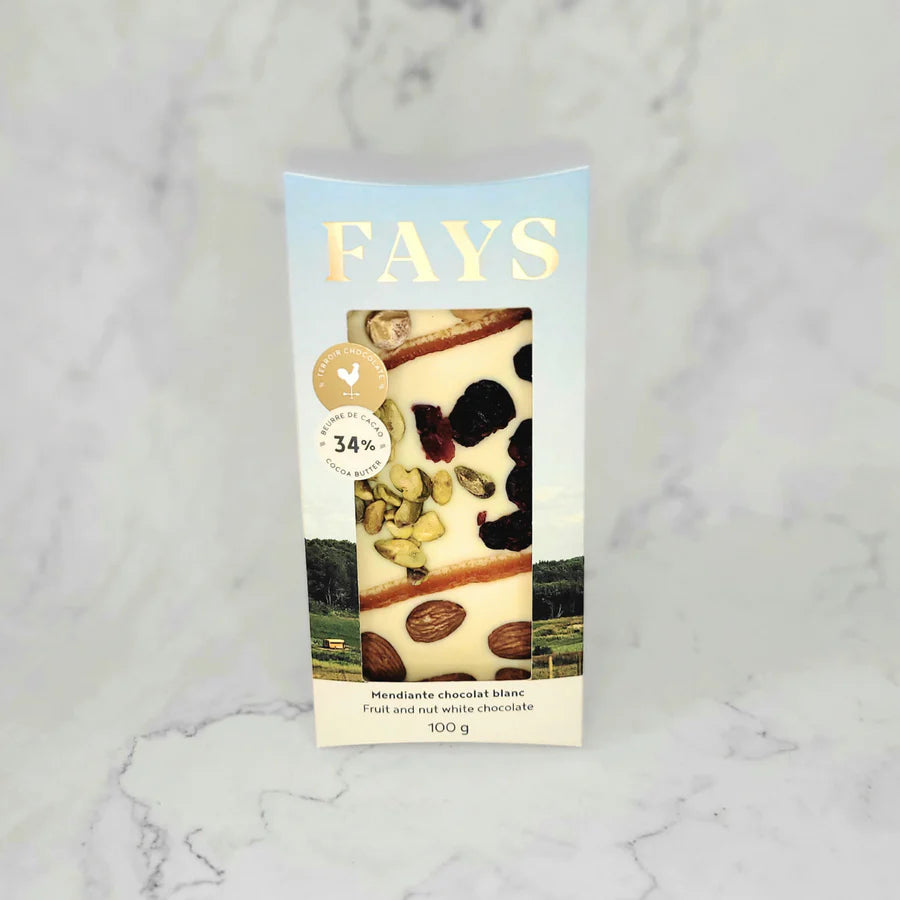 Fays white chocolate mendiante bar in its packaging on a marble surface