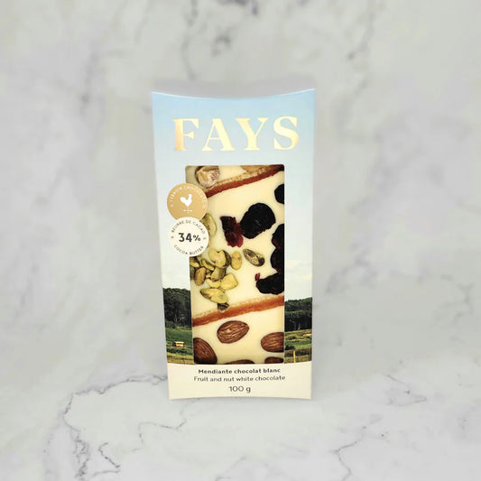 Fays white chocolate mendiante bar in its packaging on a marble surface