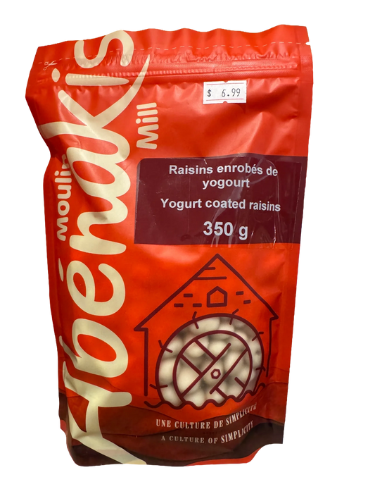 Abénakis Yogurt coated raisins in orange bag on a wood shelf