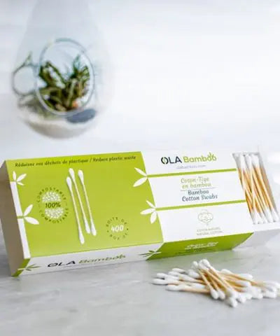 box of Ola Bamboo qtips with plant hanging in background