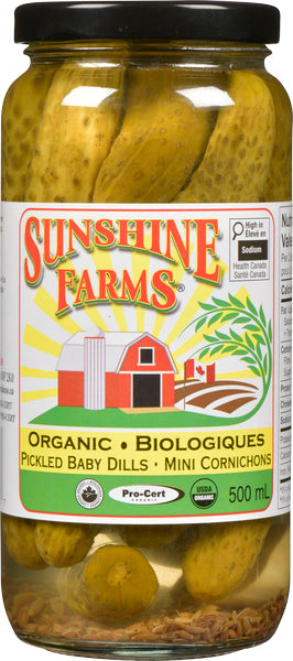 A jar of Sunshine Farms organic mini dill pickles, featuring small whole pickles in brine with visible herbs and spices.
