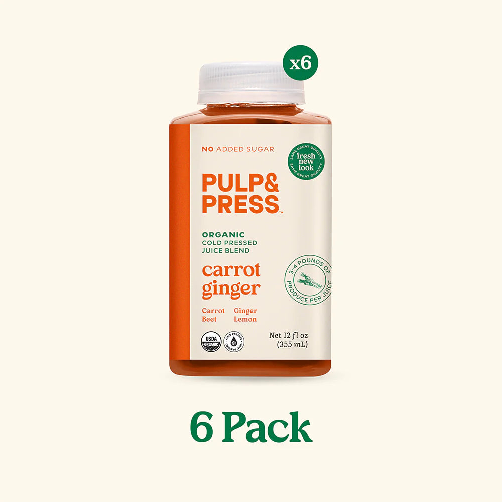 A bottle of Pulp & Press Juice Co. carrot ginger juice, showcasing a vibrant orange blend with earthy carrot and zesty ginger.