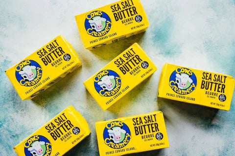 A package of Cows Creamery salted butter (84% fat), featuring a rich, creamy butter with added salt in branded packaging.