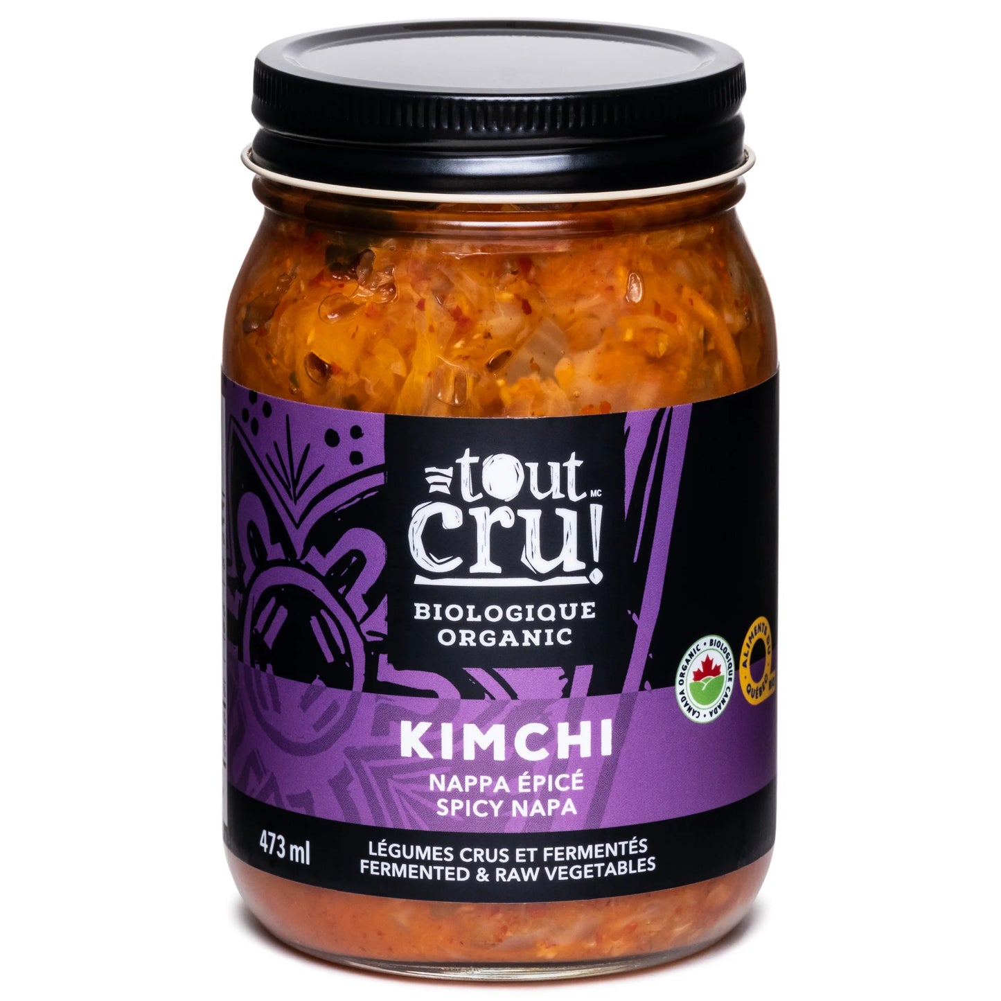 A jar of Tout Cru! organic Napa kimchi, featuring fermented cabbage with visible chili flakes and vegetables in a vibrant, spicy brine.