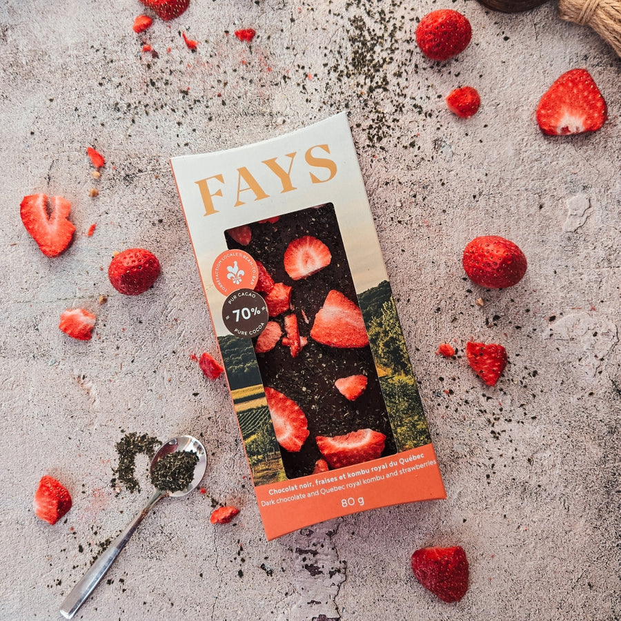 Fays chocolate bar packaging with strawberries on a textured surface