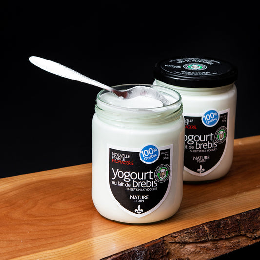 A glass jar of Nouvelle France sheep’s milk yogurt labeled Nature / Plain
