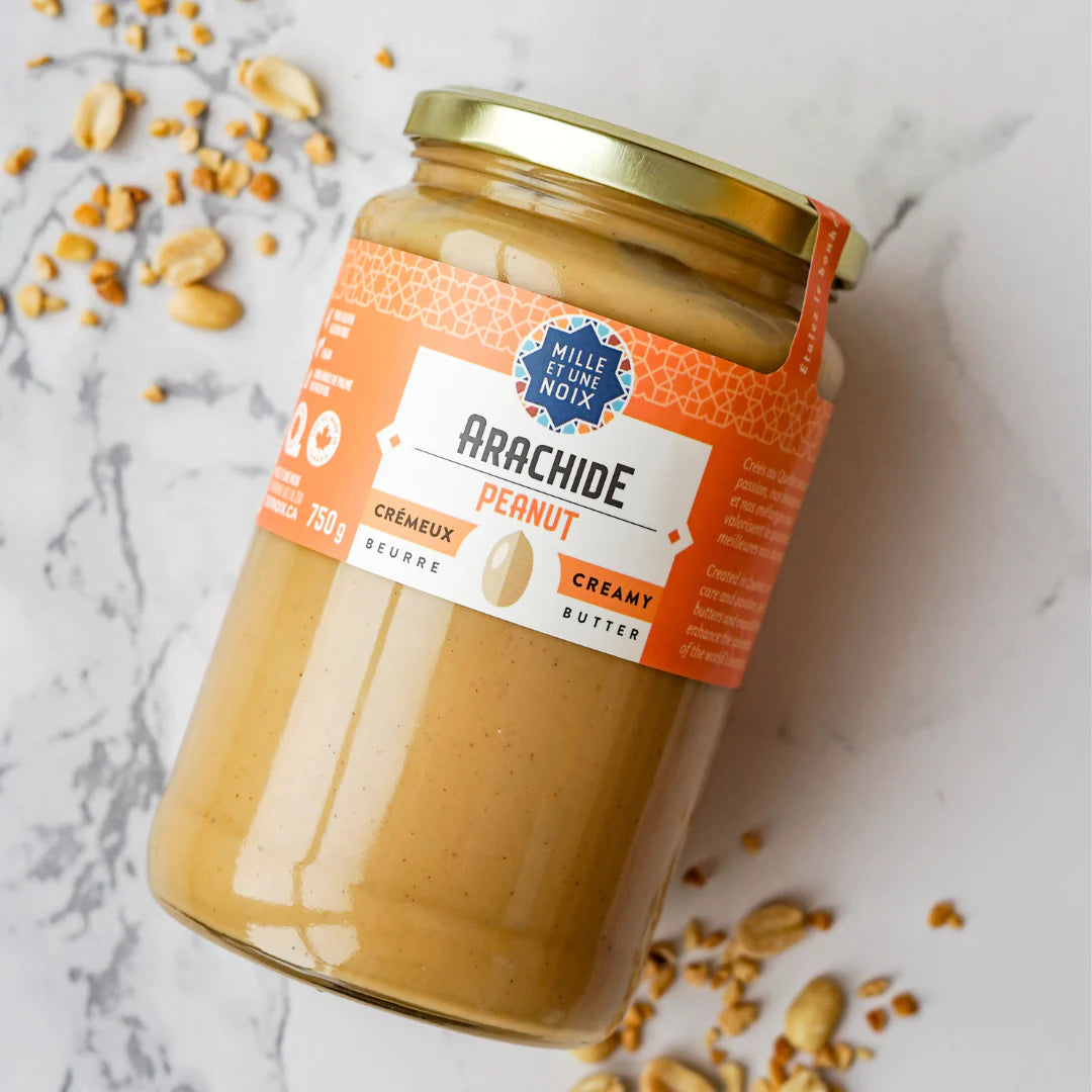 A jar of Mille et Une Noix creamy peanut butter (750g), featuring a smooth, rich peanut spread in large-format.