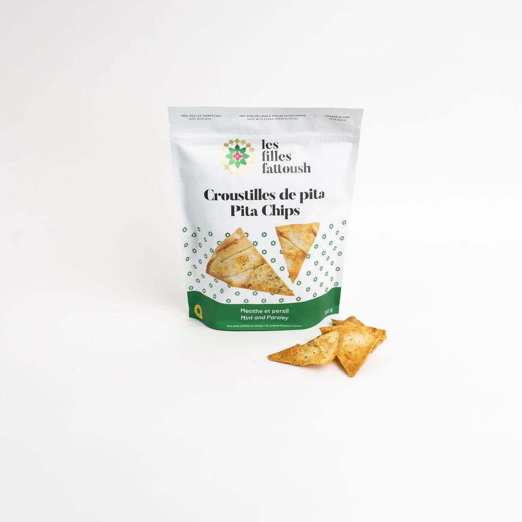 A bag of Les Filles Fattoush pita chips mint and parsley, showcasing crunchy pita chips with fresh herbal flavors.