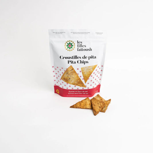 A bag of Les Filles Fattoush pita chips sumac and fleur de sel, featuring crispy baked pita chips with tangy sumac and delicate sea salt.