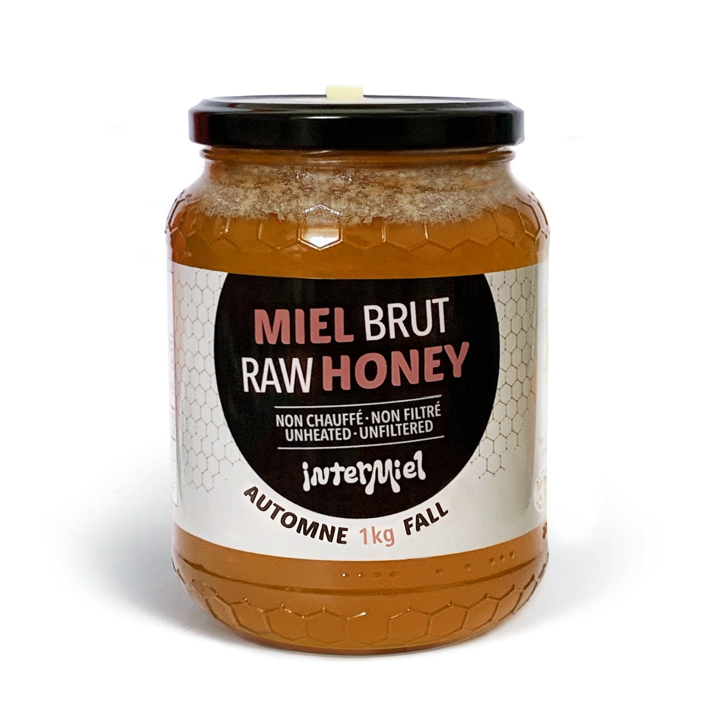 1 kg jar of raw fall harvest honey by Intermiel on a white background