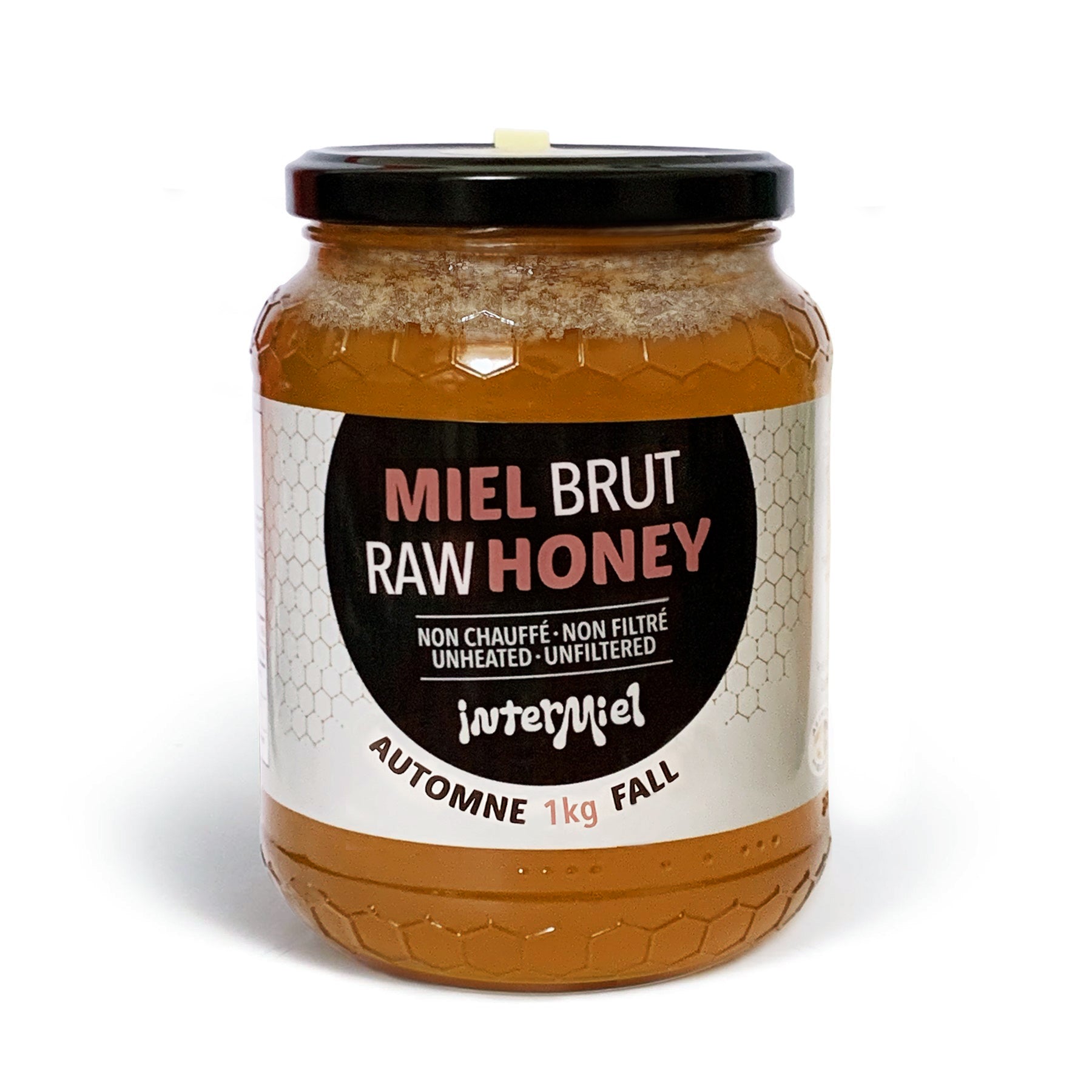 1 kg jar of raw fall harvest honey by Intermiel on a white background