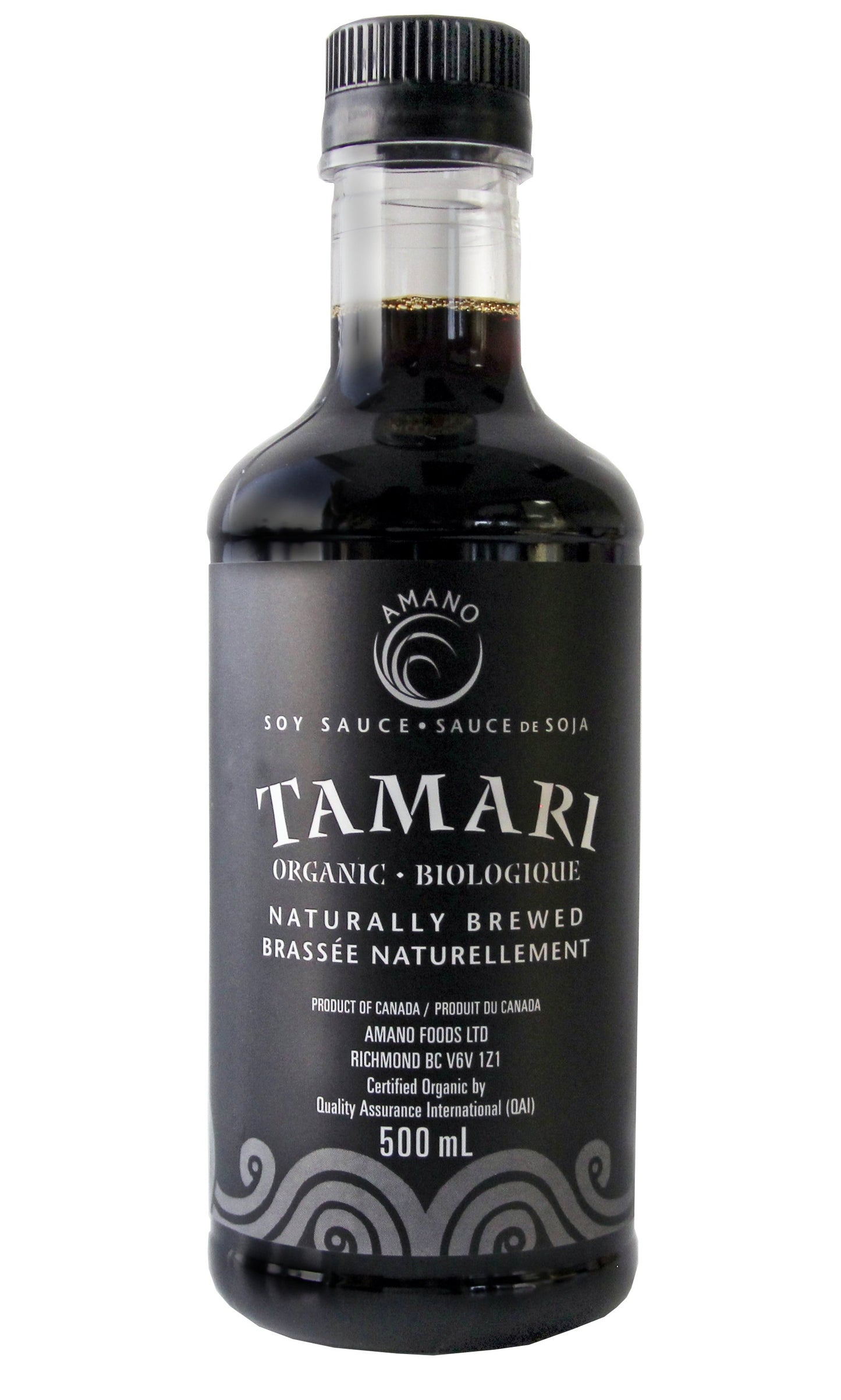 A bottle of Amano organic tamari sauce, featuring a dark, gluten-free soy sauce alternative in a labeled glass bottle.