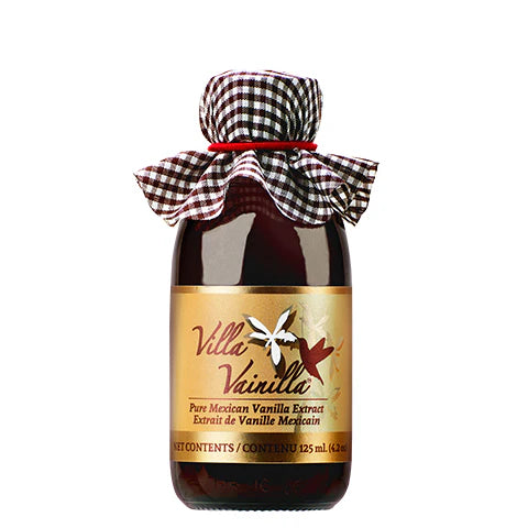 Bottle of Villa Vanilla extract with a checkered cloth cover on a white background