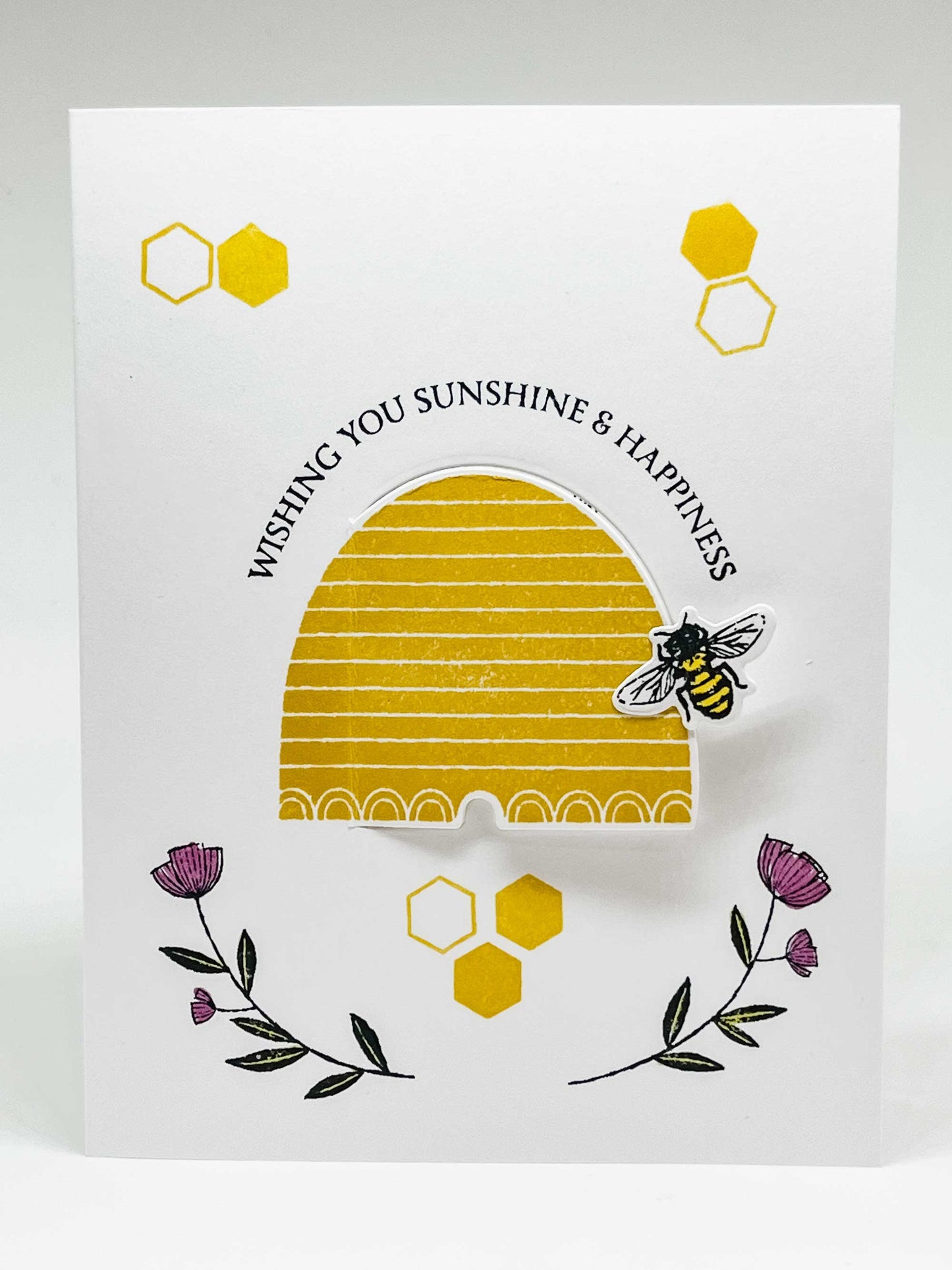 Pop-up greeting card with 2 flowers, a honeybee on a hive, and text that wishing you sunshine & happiness