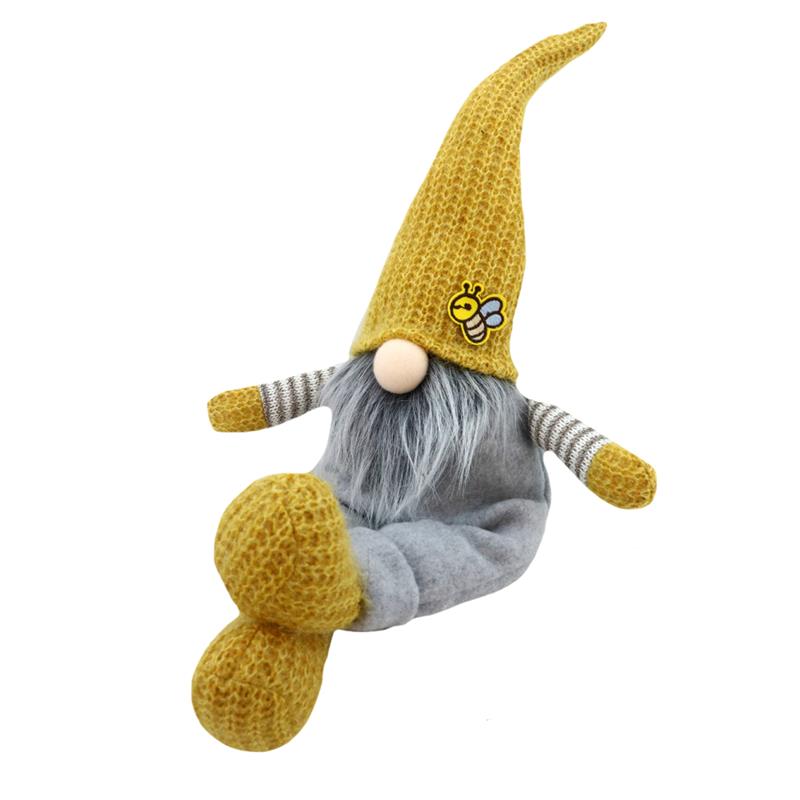 Gnome plushie in grey overalls and yellow wool hat with bee design