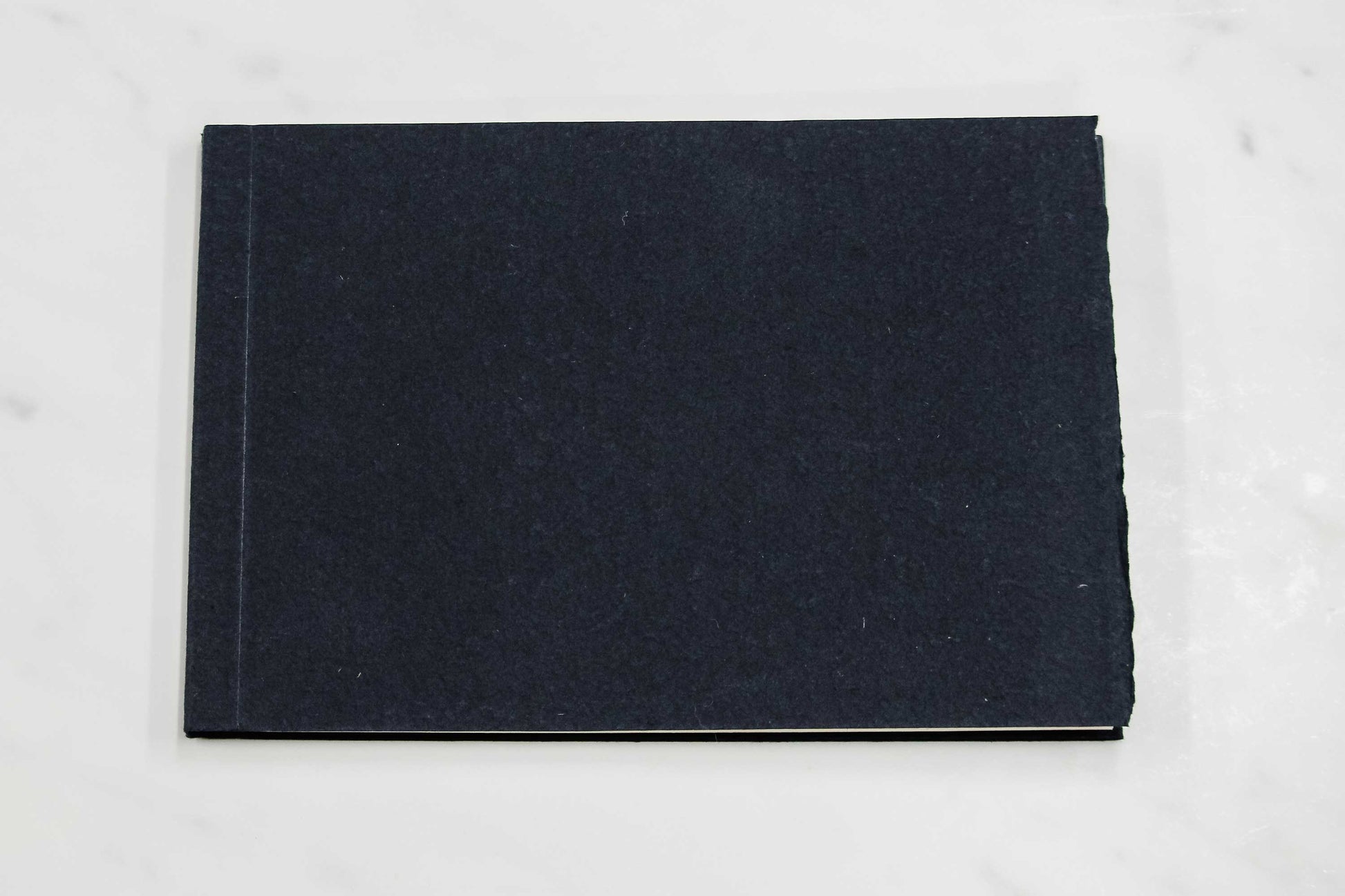 5 1/2-inch by 8-inch handmade Papeterie St. Armand cotton paper notepad with dark blue cover