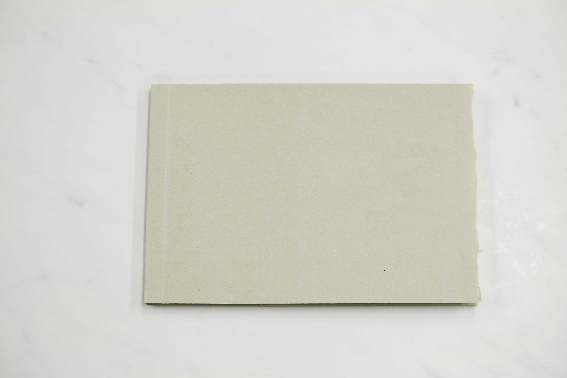 5 1/2-inch by 8-inch handmade Papeterie St. Armand cotton paper notepad with grey cover