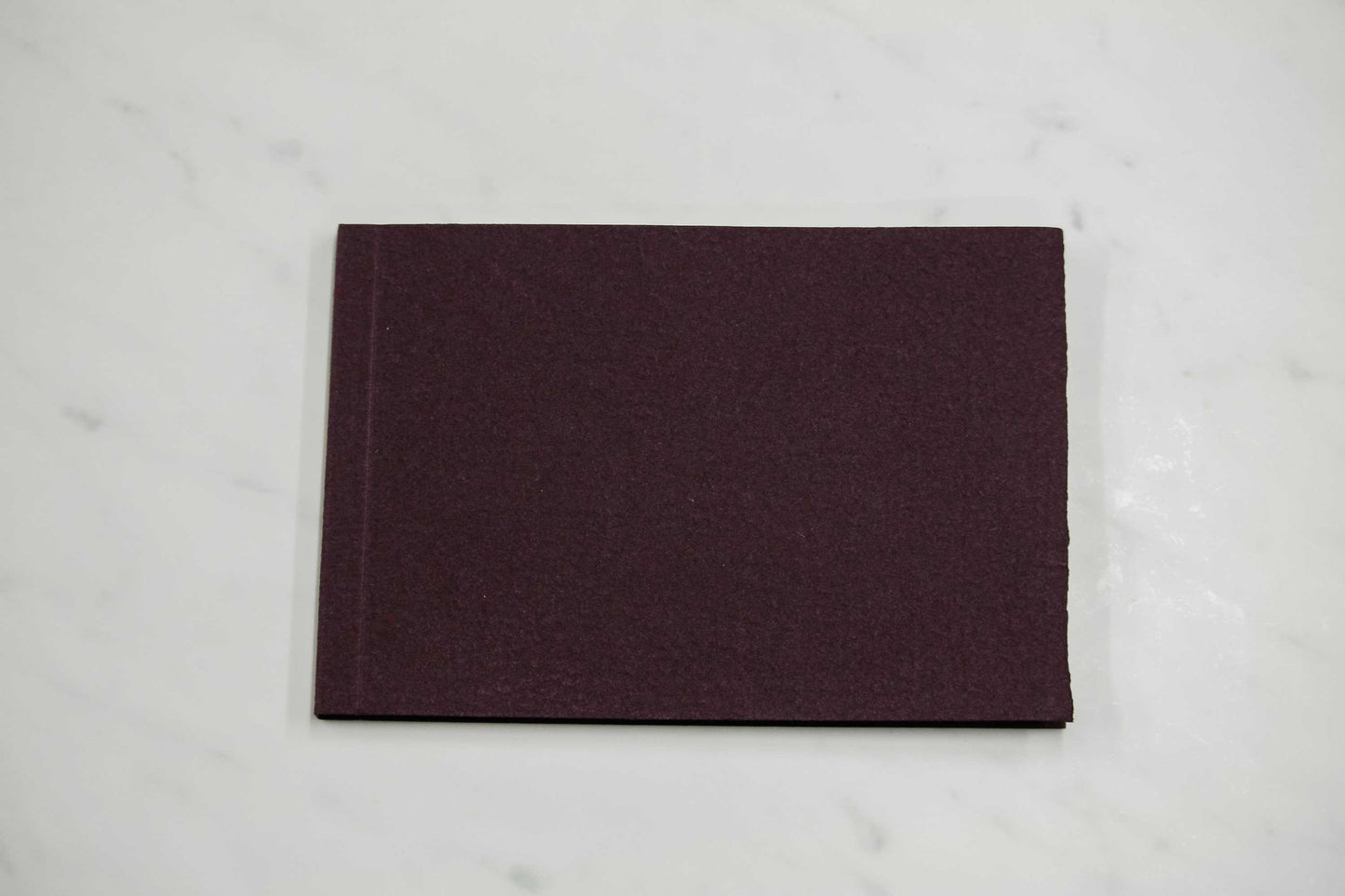 5 1/2-inch by 8-inch handmade Papeterie St. Armand cotton paper notepad with burgundy cover