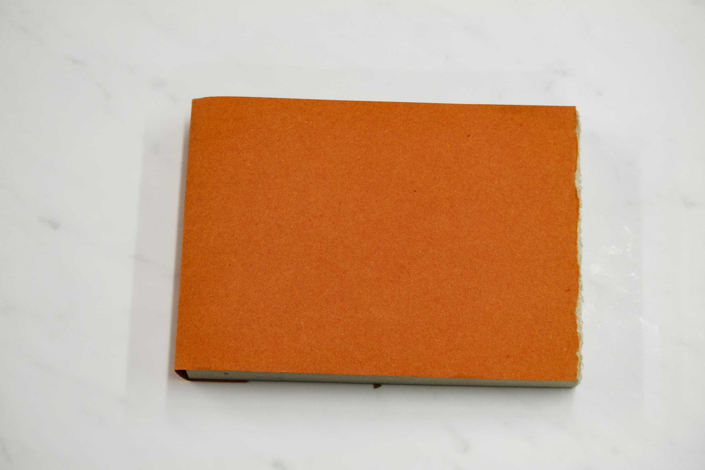 6-inch by 8-inch handmade Papeterie St. Armand cotton paper notepad with orange cover
