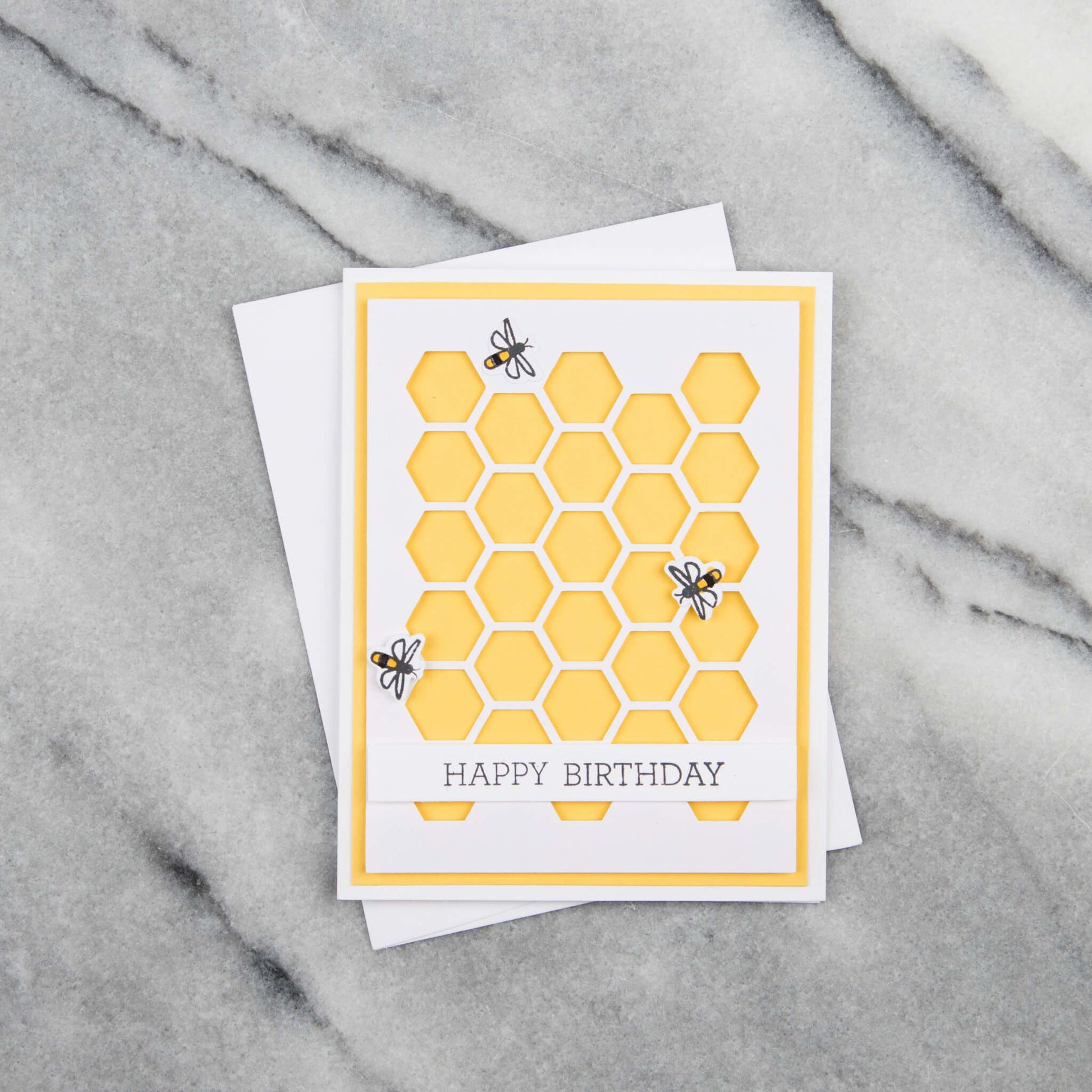 Birthday card with honeycomb pattern and text that says, happy birthday