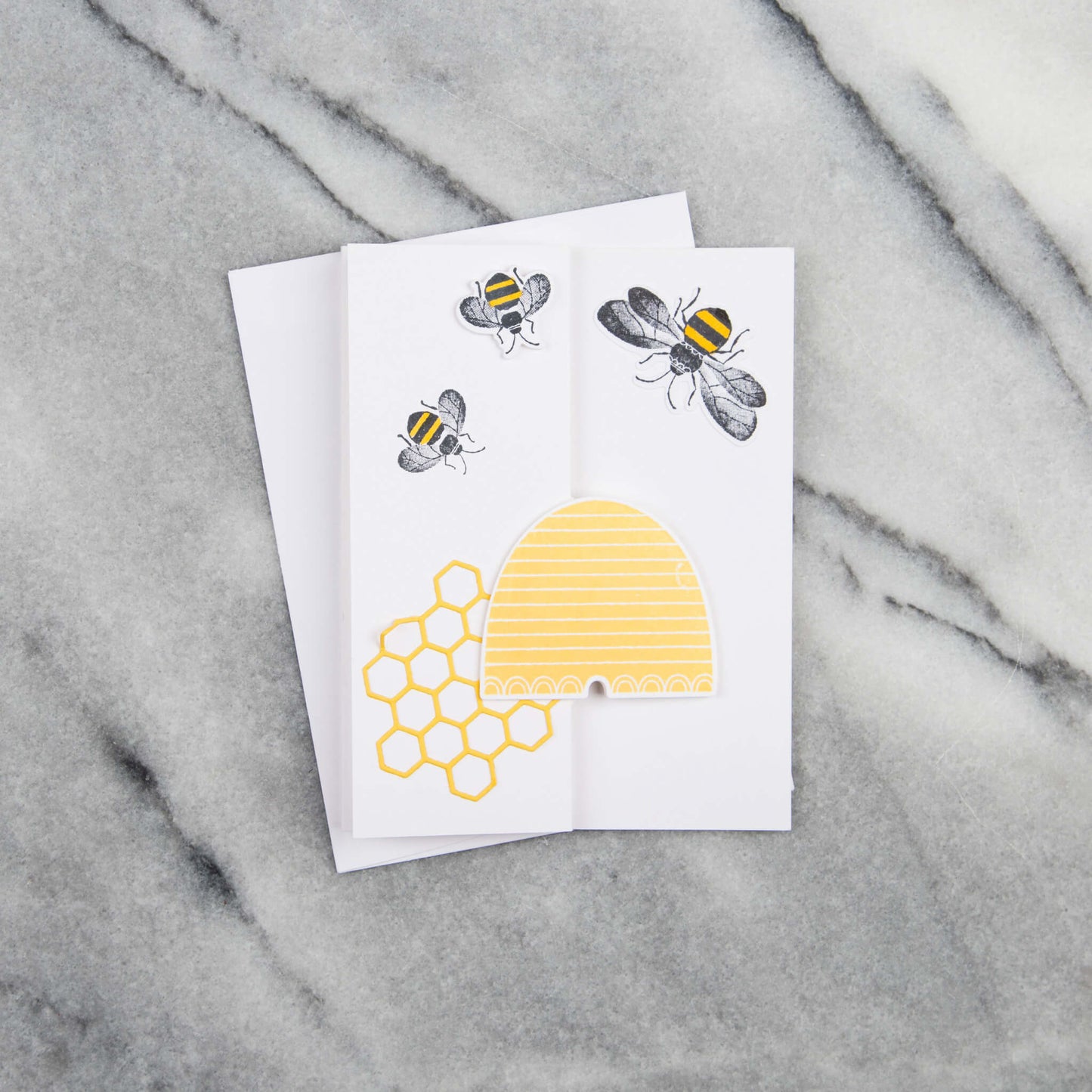 Pop-up greeting card with a hive, honeycomb pattern, and honeybees