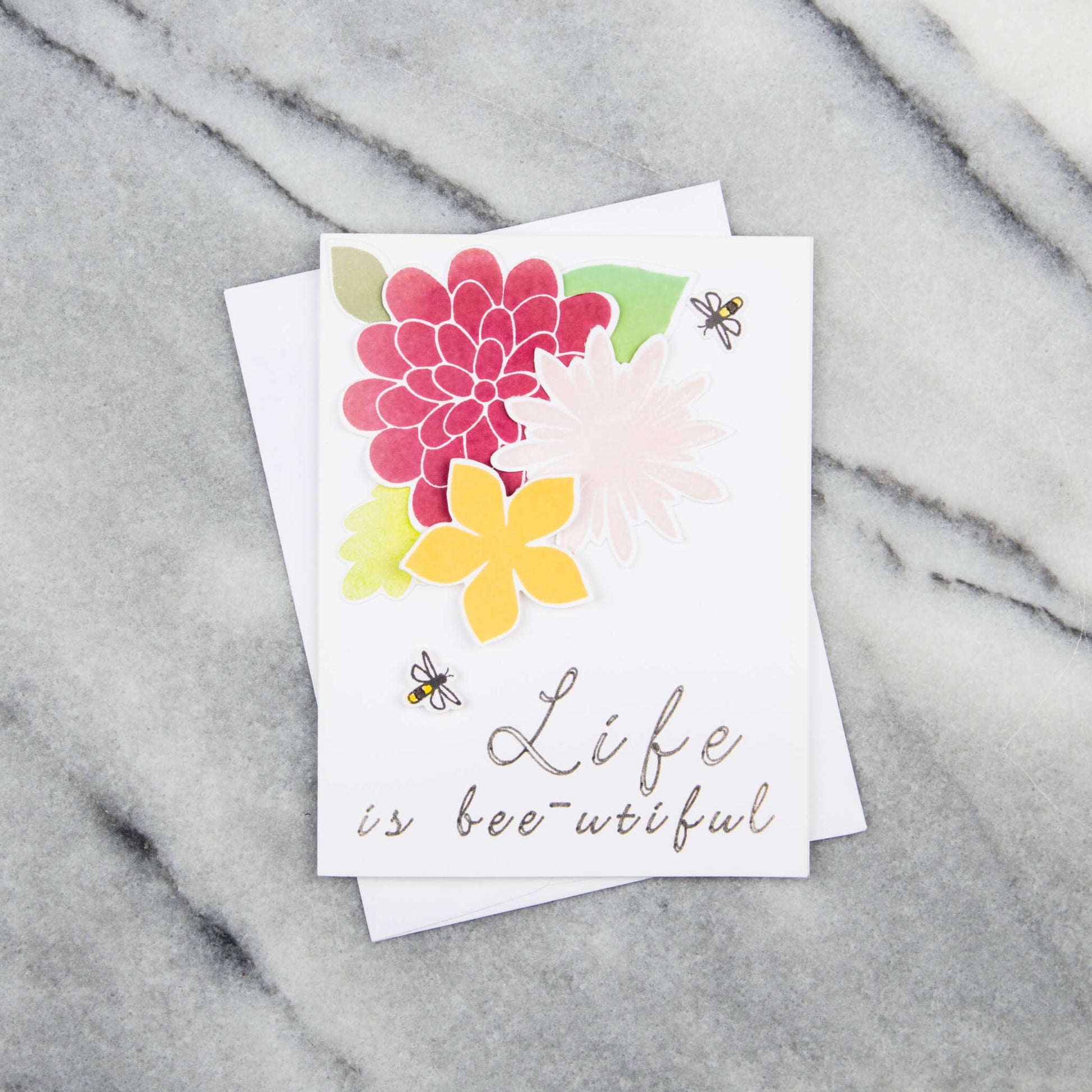 Pop-up greeting card with honeybee, flowers and text that says a life is bee-utiful