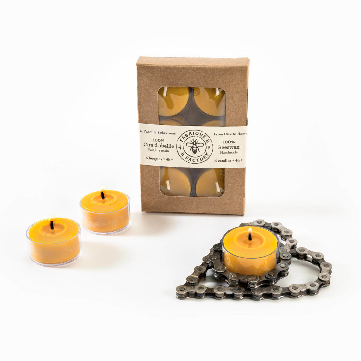 3 lit beeswax tea light candles in front of gift box with 6 pure beeswax tea light candles by B Factory