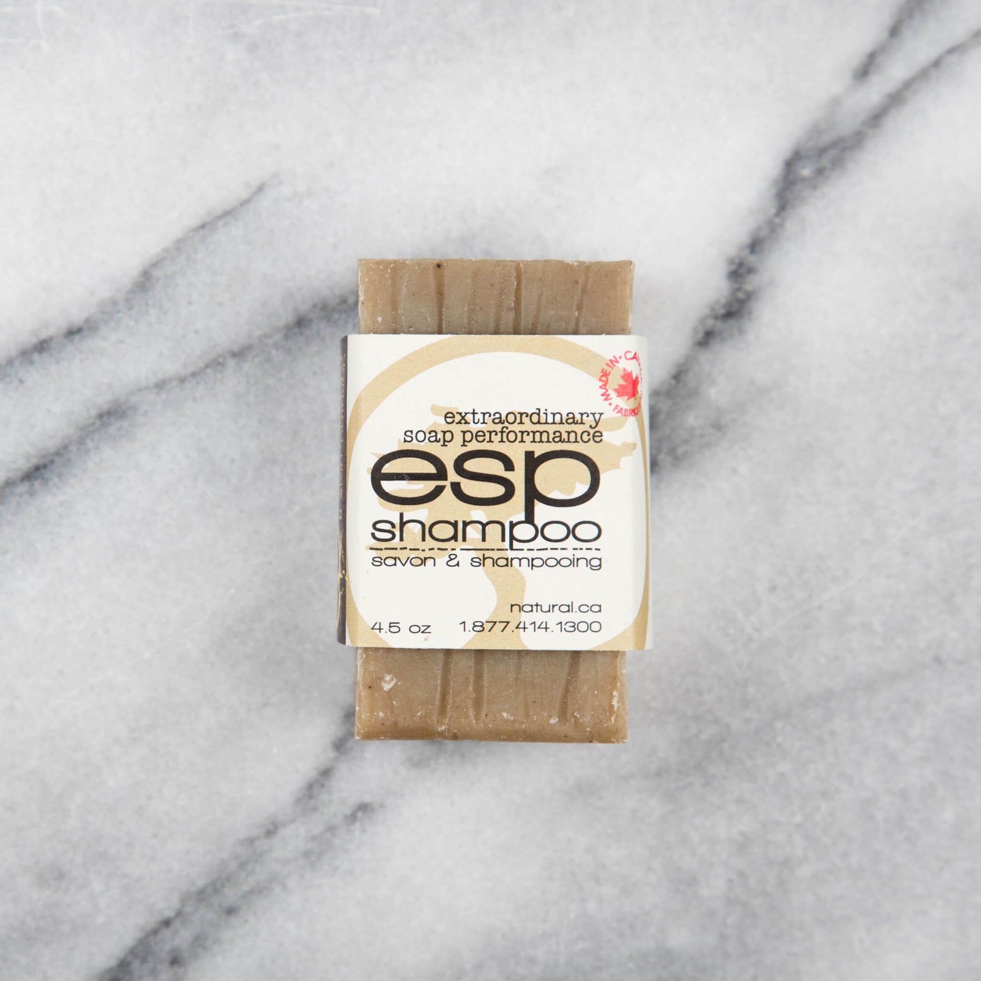 Earth to Body eco-friendly shampoo bar on marble counter